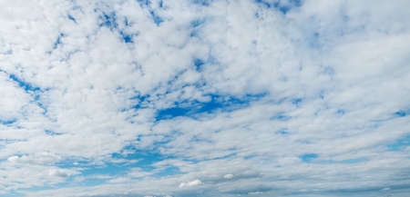 Stratocumulus clouds. Panoramic view of the massive cloudy skyの写真素材