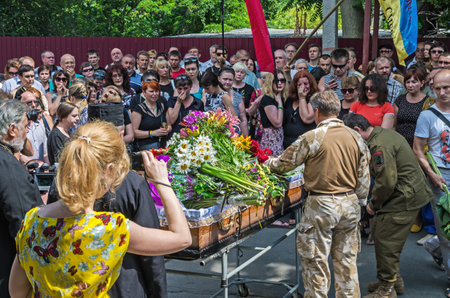 Dnipro, Ukraine - June 30, 2016: Near the morgue building people say goodbye to Ukrainian baritone singer Paris Opera Vasyl Slipak who was killed during the Russian-Ukrainian war in Donbasのeditorial素材