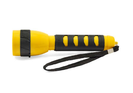 Yellow and black pocket electric flashlight isolated on white backgroundの写真素材