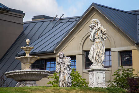 Fountain and statues in the park in summer.の写真素材