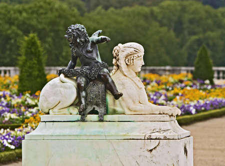 Figure of a sphinx in white marble, carrying a bronze Cupidの写真素材