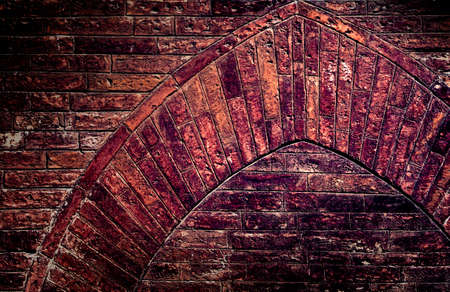 The weather worn red brick wall textureの写真素材
