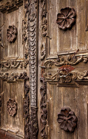Architectonic detail of the aged grunge wooden doorの写真素材