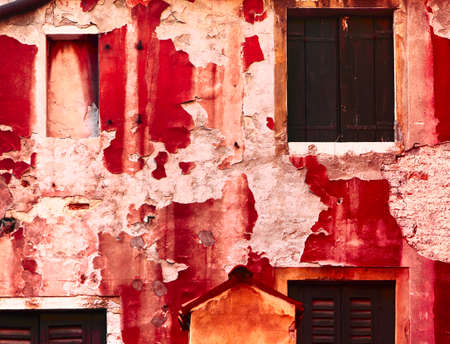The old textured red wall in Veniceの写真素材