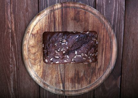 Top view of a traditional bread  on a wooden cutting board