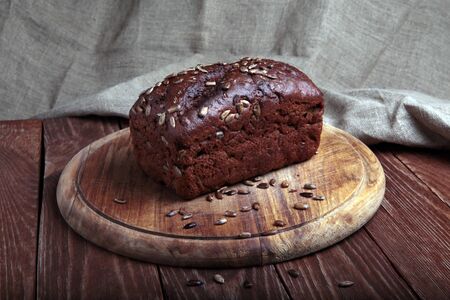 Front view of a traditional bread  on a wooden cutting board