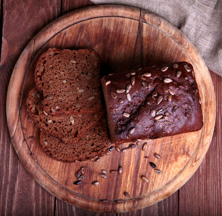 Top view of a sliced traditional bread  on a wooden cutting boardの写真素材