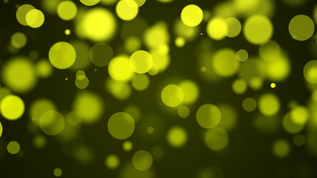 yellow particles background with bokeh の写真素材