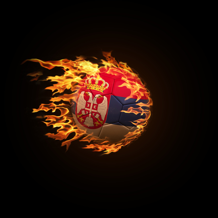 A soccer ball with the flag of Serbia burning with fire flies on a black background 3d renderの写真素材