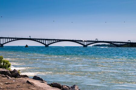 Bright blue lake Erie and the bridge across it