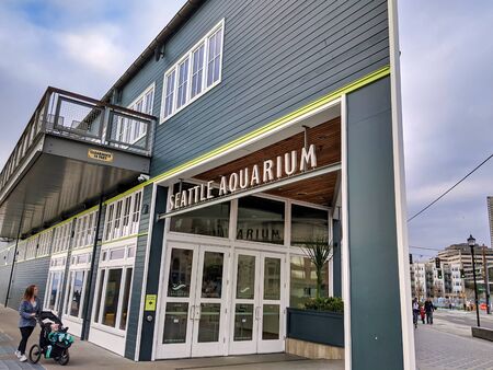 Seattle, WA / USA - circa November 2019: Street view of people walking near the Seattle Aquarium in...