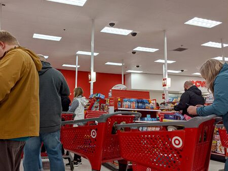 Woodinville, WA / USA - circa January 2020: People purchasing emergency food and emergency...
