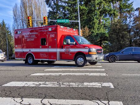 Kirkland, WA / USA - circa December 2019: City of Bothell Fire and E.M.S. aid unit truck making its...