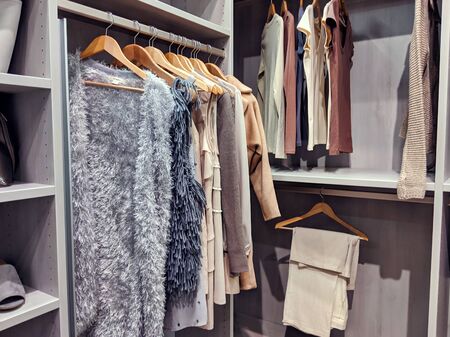 A well stocked walk in closet with all clothing and shoes organized withinの写真素材