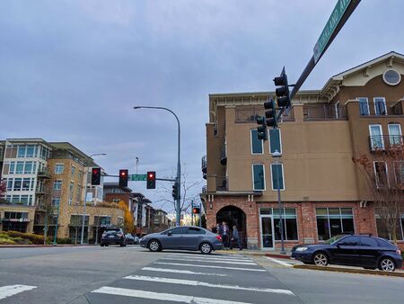 Kirkland, WA / USA - circa November 2019: Car and bus traffic passing through the Kirkland Avenue...