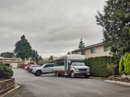 Kirkland, WA / USA - circa March 2020: Street view of the Life Care Center of Kirkland shuttle bus, ground zero of the coronavirus outbreak in Kirkland.のeditorial素材