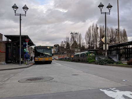 Kirkland, WA / USA - circa February 2020: Street view of a King County Metro bus parked at the pump...
