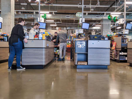 Kirkland, WA / USA - circa March 2020: View of customers shopping for groceries at QFC during the...