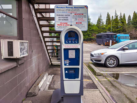 Seattle, WA / USA - circa November 2019: Selective focus on a public parking payment meter as it displays a 'thank you' message in the industrial Georgetown neighborhood.のeditorial素材