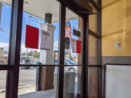 Seattle, WA / USA - circa March 2020: Front door of UW Medicine Clinic in Shoreline, covered in...