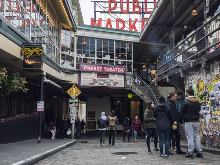Seattle, WA / USA - circa November 2019: Crowd of people making their way around Pike Place market...