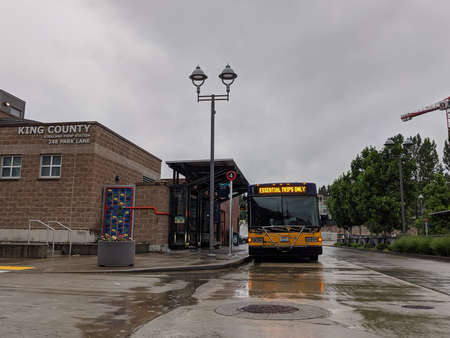 Kirkland, WA / USA - circa May 2020: Street view of a King County Metro bus stating 'Essential Trips...