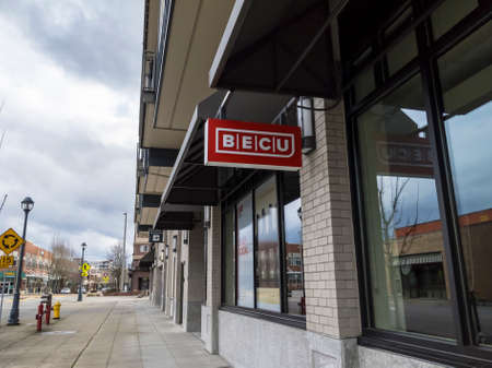 Redmond, WA USA - circa March 2021: Street view of a BECU bank and credit union in a shopping district.のeditorial素材