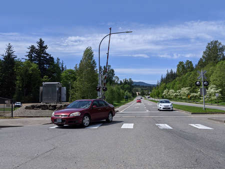 Snoqualmie, WA USA - circa May 2020: View of cars on the highway, heading toward Snoqualmie Falls on...