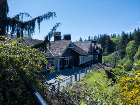 Snoqualmie, WA / USA - circa May 2020: View of the gorgeous Snoqualmie Falls with Salish Lodge and Spa in the background, on a beautiful summer dayのeditorial素材