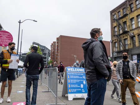 Seattle, WA USA - circa May 2021: View of separated lines for people to queue up for health screenings before getting the covid 19 vaccine.のeditorial素材