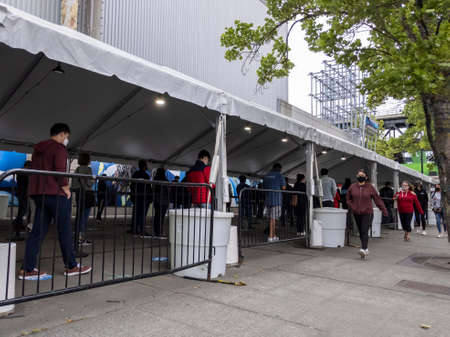 Seattle, WA USA - circa May 2021: View of separated lines for people to queue up for health screenings before getting the covid 19 vaccine.のeditorial素材