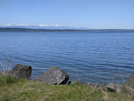 Beautiful view of the  mountains across the Pacific Ocean on a sunny, cloudless dayの写真素材