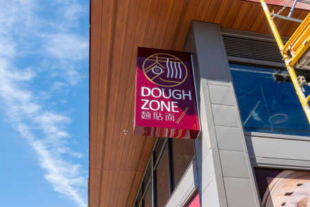 Kirkland, WA USA - circa May 2021: Low angle view of the entrance to a Dough Zone restaurant, opening in downtown Kirkland.のeditorial素材