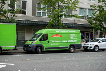 Bellevue, WA USA - circa June 2021: Street view of a Servpro van parked on the side of the road in downtown Bellevue.のeditorial素材