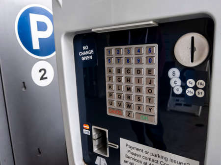 Bothell, WA USA - circa April 2021: Close up view of a public parking payment meter at the University of Washington.のeditorial素材