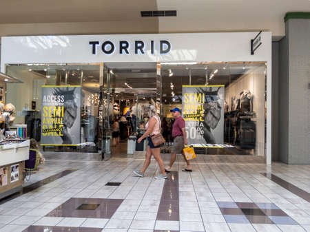 Lynnwood, WA USA - circa July 2021: Exterior view of the entrance to a Torrid plus sized clothing store inside the Alderwood Mall.のeditorial素材
