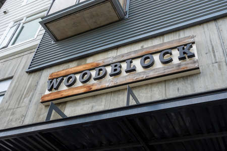 Redmond, WA USA - circa August 2021: Low angle view of the entrance to Woodblock upscale restaurant.のeditorial素材