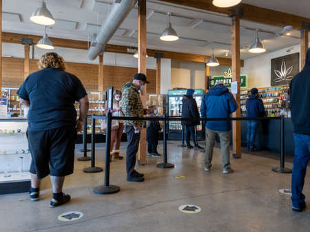 Woodinville, WA USA - circa December 2021: View of customers waiting in line at High Leaf cannabis...