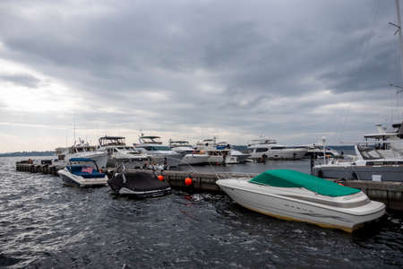 Kirkland WA USA circa July 2020: Boats docked on Lake Washington on an overcast day at sunset.のeditorial素材