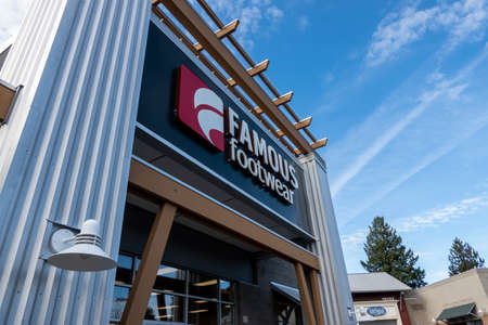 Woodinville, WA USA - circa February 2022: Low angle view of a Famous Footwear store front on a bright, sunny day.のeditorial素材