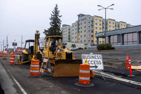 Lynnwood, WA USA - circa February 2022: View of a construction bulldozer in the heart of downtown,...