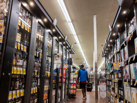 Lynnwood, WA USA - circa April 2022: View of an African American young man shopping for liquor inside a Safeway grocery store.のeditorial素材