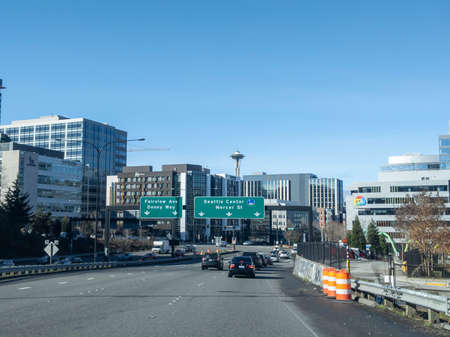 Seattle, WA USA - circa March 2022: Street traffic view of cars heading into downtown Seattle, toward Mercer Street and the Seattle Center on a bright, sunny day.のeditorial素材