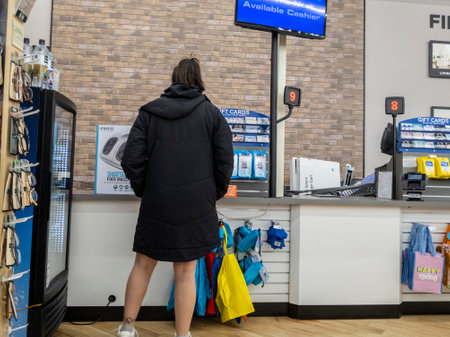Lynnwood, WA USA - circa April 2022: View of a Caucasian woman checking out with a cashier at Bed...