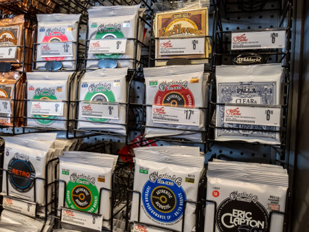 Lynnwood, WA USA - circa May 2022: Angled view of guitar strings for sale inside a Guitar Center musical instrument store.のeditorial素材