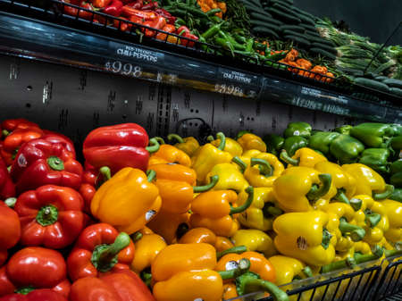 Mill Creek, WA USA - circa April 2022: Angled, selective focus on an assortment of bell peppers for...
