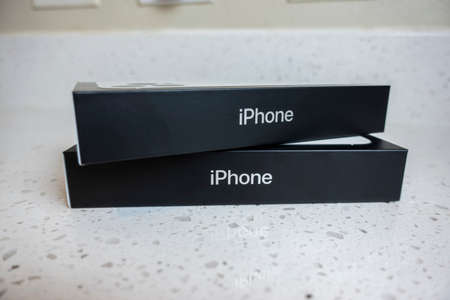 Seattle, WA USA - circa May 2022: View of two iPhone 13 Pro boxes on a kitchen counter inside a home