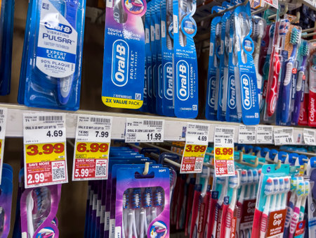 Everett, WA USA - circa June 2022: Angled close up of a variety of toothbrushes for sale inside a Fred Meyer grocery store.のeditorial素材