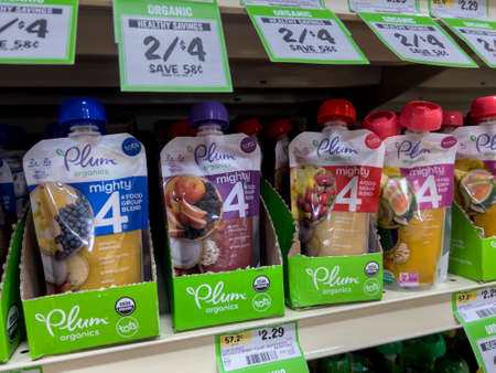 Seattle, WA USA - circa June 2022: Close up view of Plum brand baby food for sale inside a Sprouts Market.のeditorial素材