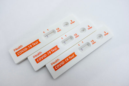 Seattle, WA USA - circa July 2022: Close up, selective focus on several covid 19 tests on a white background.のeditorial素材